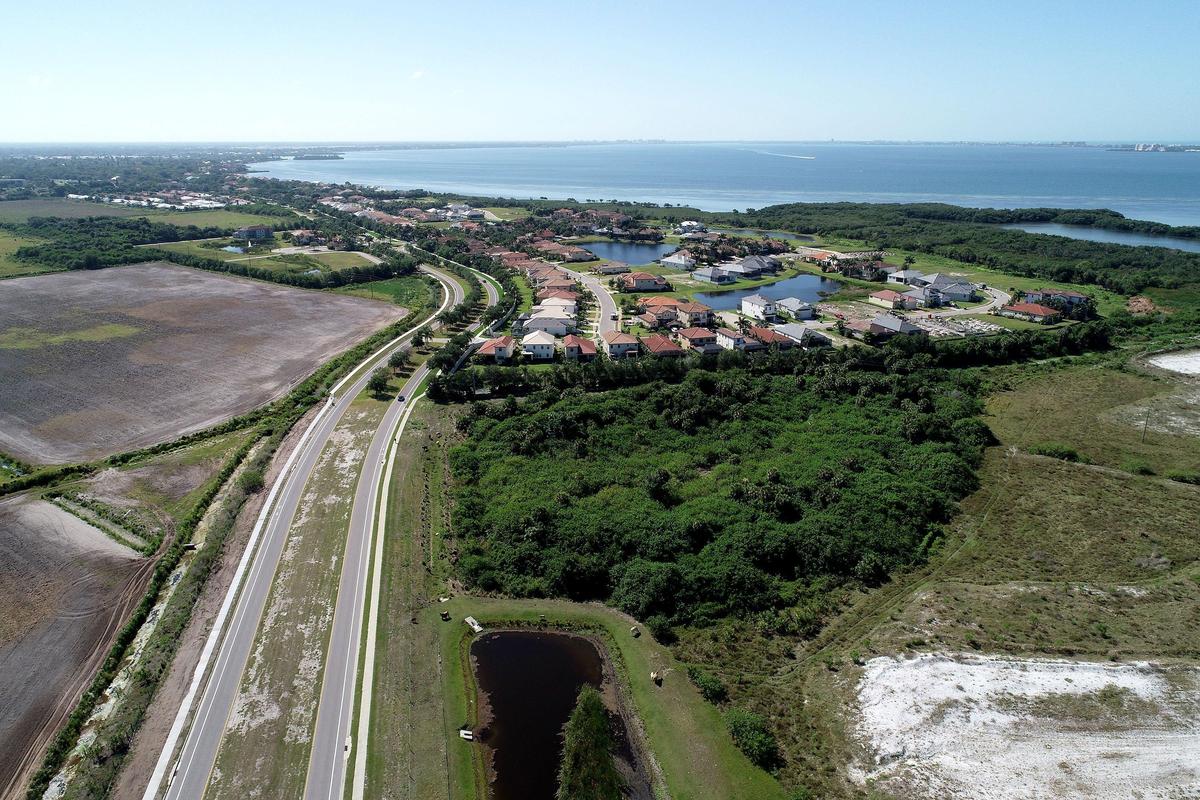The developer has secured a line of credit to allow construction to start on the first neighborhood of Aqua by the Bay .