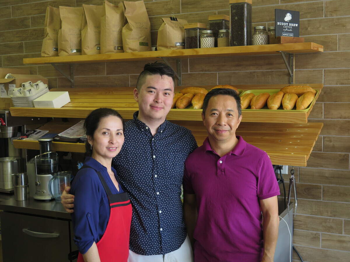 From left: Mai Ngo, Kevin Le and Van Le pose for a photo behind the bar at Little Saigon Cafe. The family originally opened their restaurant as a doughnut shop in September 2017, but found that their customers were more interested in the Vietnamese food that they added to their menu a few months ago.
