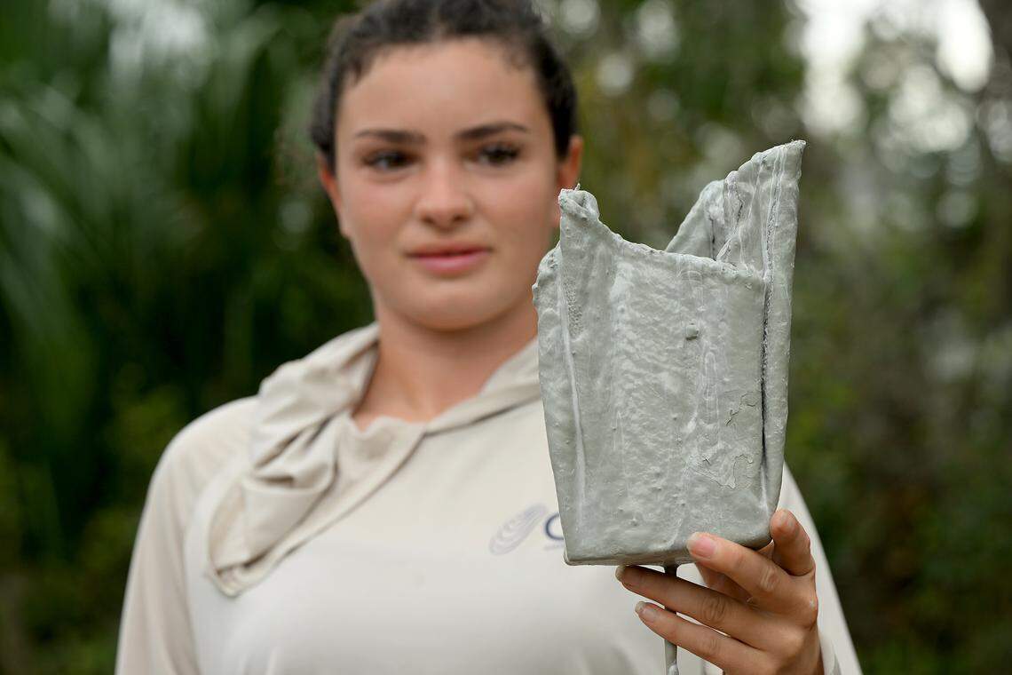 Abbey Kuhn, ecological project coordinator of Oyster River Ecology with one of their concrete rag pots on Feb. 27, 2026.