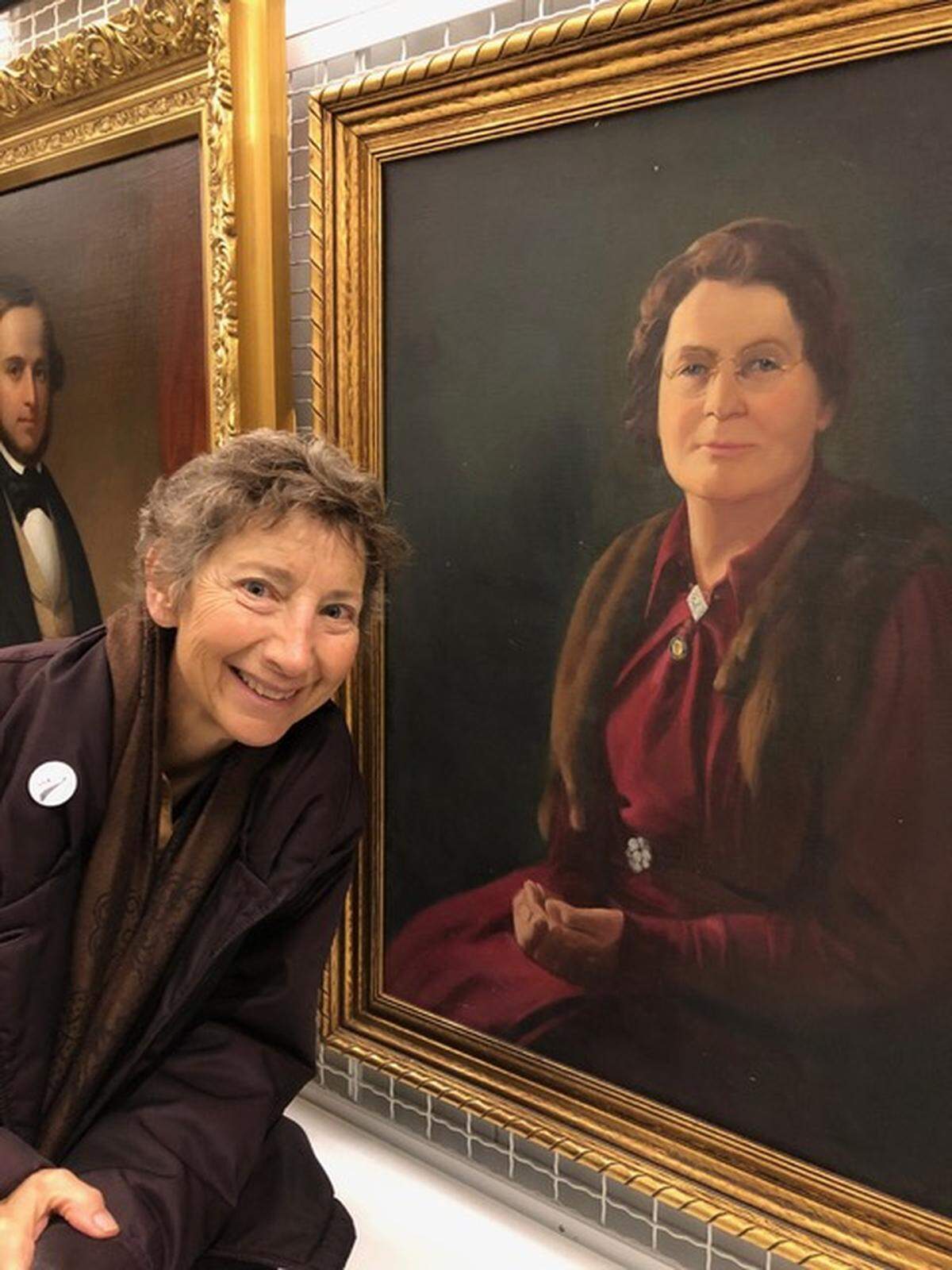 Author Jane Plitt is shown with a portrait of Martha Matilda Harper. Plitt has produced a documentary based on her book, “Martha Matilda Harper and the American Dream: How One Woman Changed the Face of Modern Business.” The book tells the story of a former servant girl who invented business franchising.