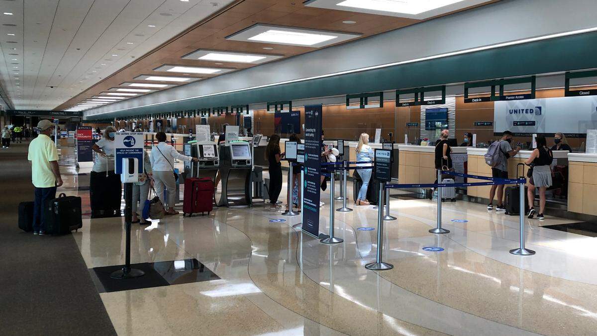 Passenger traffic is returning to Sarasota Bradenton International Airport have coming to near standstill in April because of the pandemic. Shown above are passengers checking in at the United ticket counter on Monday.