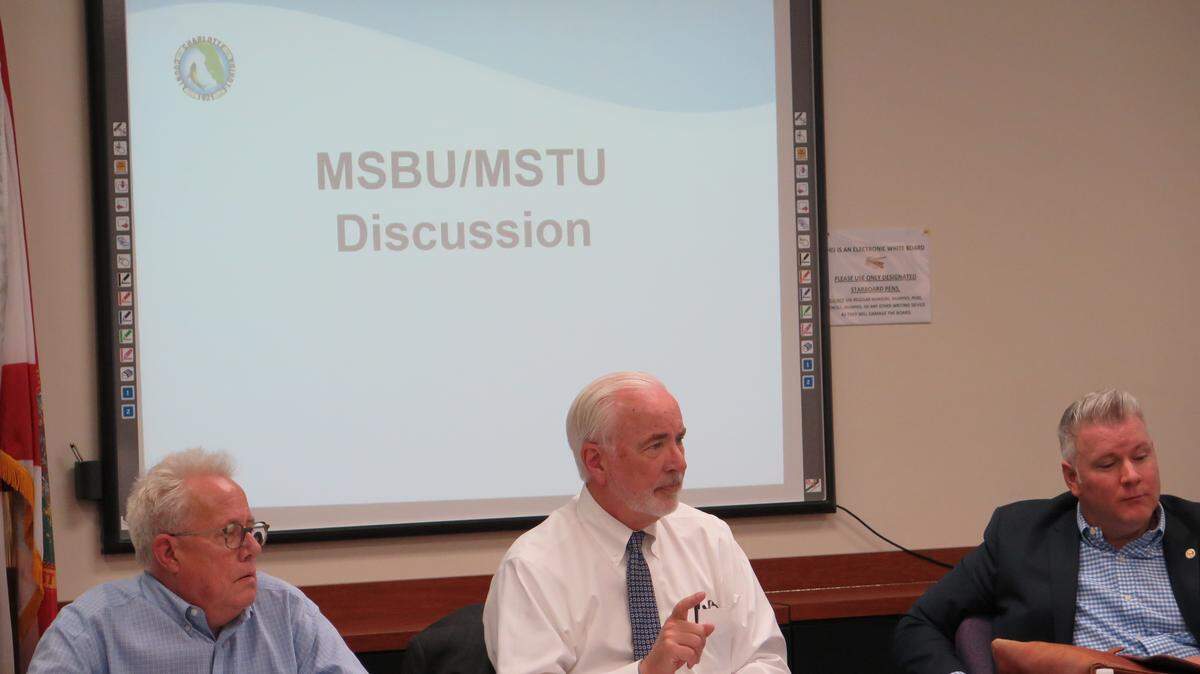 Charlotte County Administrator Ray Sandrock, Manatee County Administrator Ed Hunzeker and Leon County Administrator Vincent Long talk about how each of their respective counties fund themselves during Thursday's Citizens Financial Structure Advisory Board meeting. 
 CLAIRE ARONSON/Bradenton Herald
