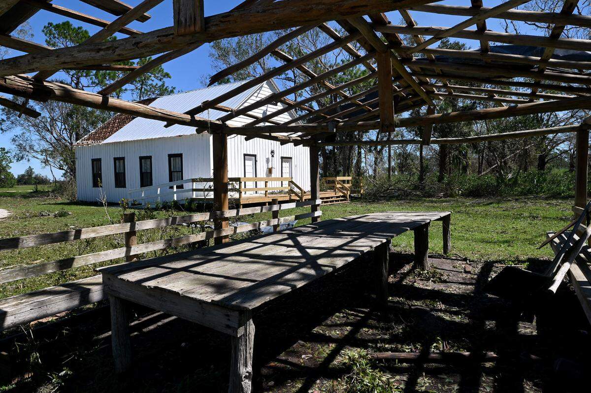 Erected in 1908, the Sandy Baptist Church in Myakka City withstood Hurricane Ian’s brutal winds, suffering some roof and window damage. A pole barn in the foreground used for functions like the popular Cowboys’ Day was also damaged.