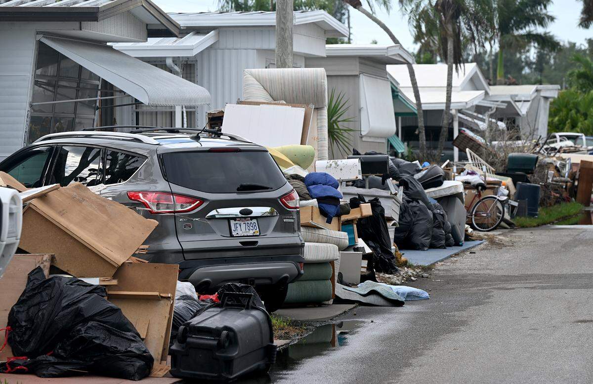 Debris from Hurricane Helene lines the streets in Sunny Shores as Hurricane Milton approaches Manatee County on Oct. 8, 2024.