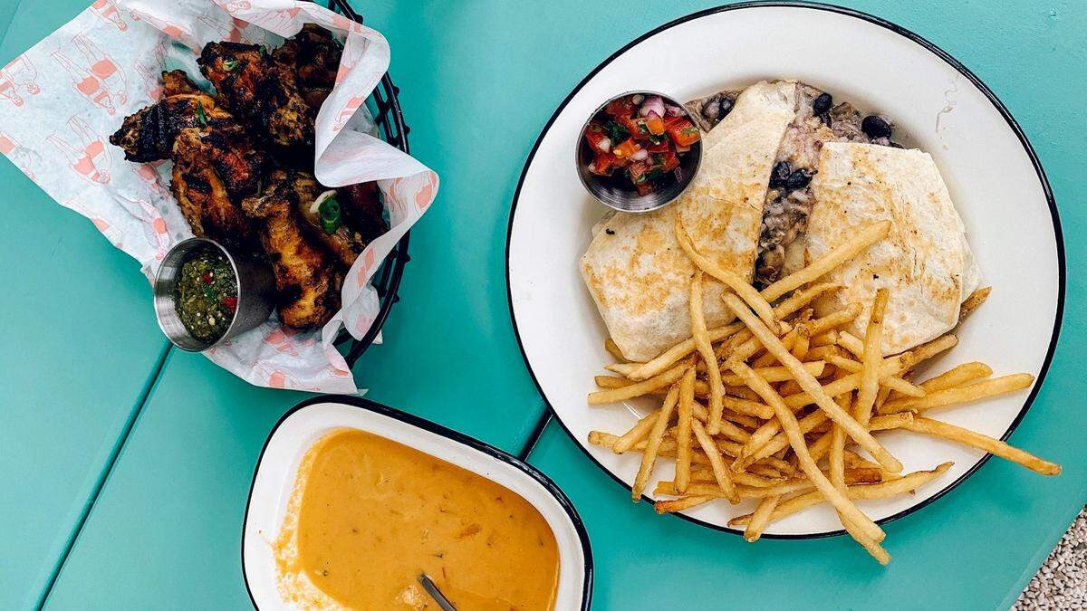 Among the offerings at Whitney’s are smoked wings, burrito served with fries and shrimp gazpacho.