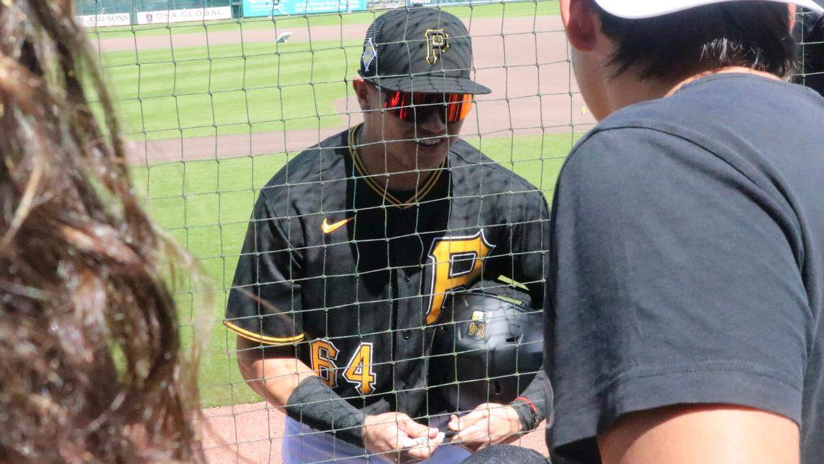 Diego Castillo and other members of the Pittsburgh Pirates baseball team signed autographs for fans before hosting the New York Yankees in a Spring Training game at LECOM Park on March 18, 2022, before a crowd of about 3,000.