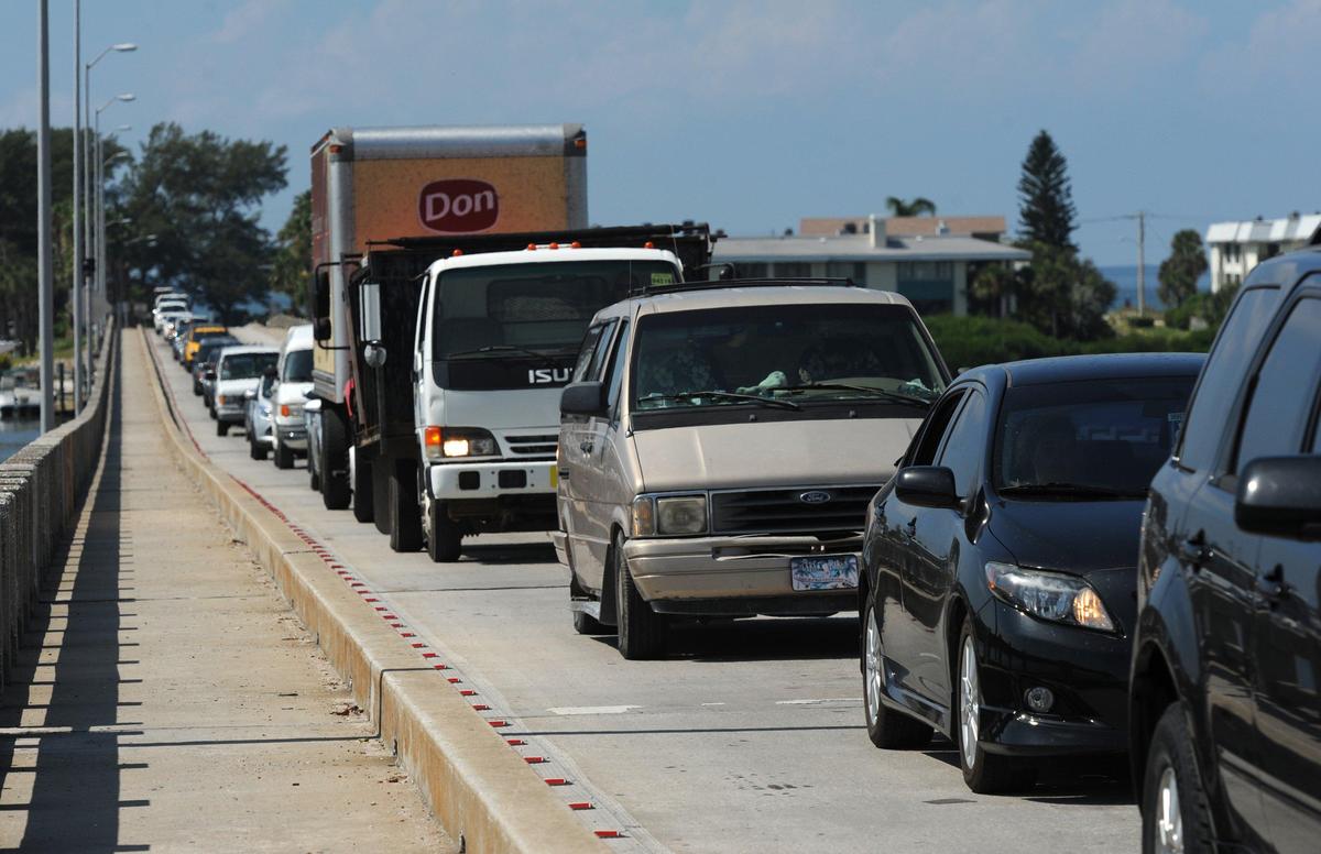 Traffic waits on the Cortez Bridge as the drawbridge opens for a sailboat traveling along the Intracoastal Waterway in this Bradenton Herald file photo.