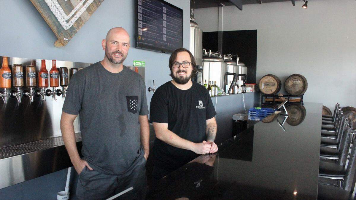 Blake Kleppe, left, and James Herrholz of Corporate Ladder Brewing Company, 4935 96th St. E., Palmetto, are committed to bringing top-flight craft beers to the Bradenton-Palmetto-Parrish area.