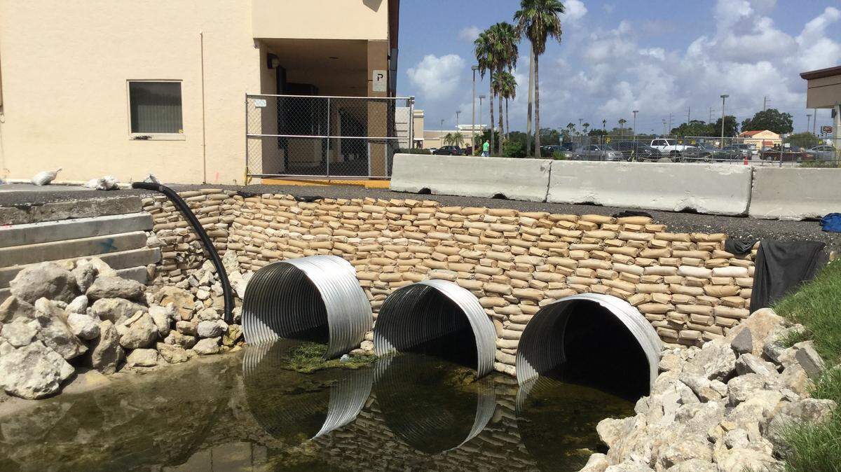 Drainage is flowing once again after years of blockage due to an absentee landlord who has refused to address the problem. Manatee County has completed emergency work on the sinkholes and will now try to get the property owner to reimburse taxpayers.