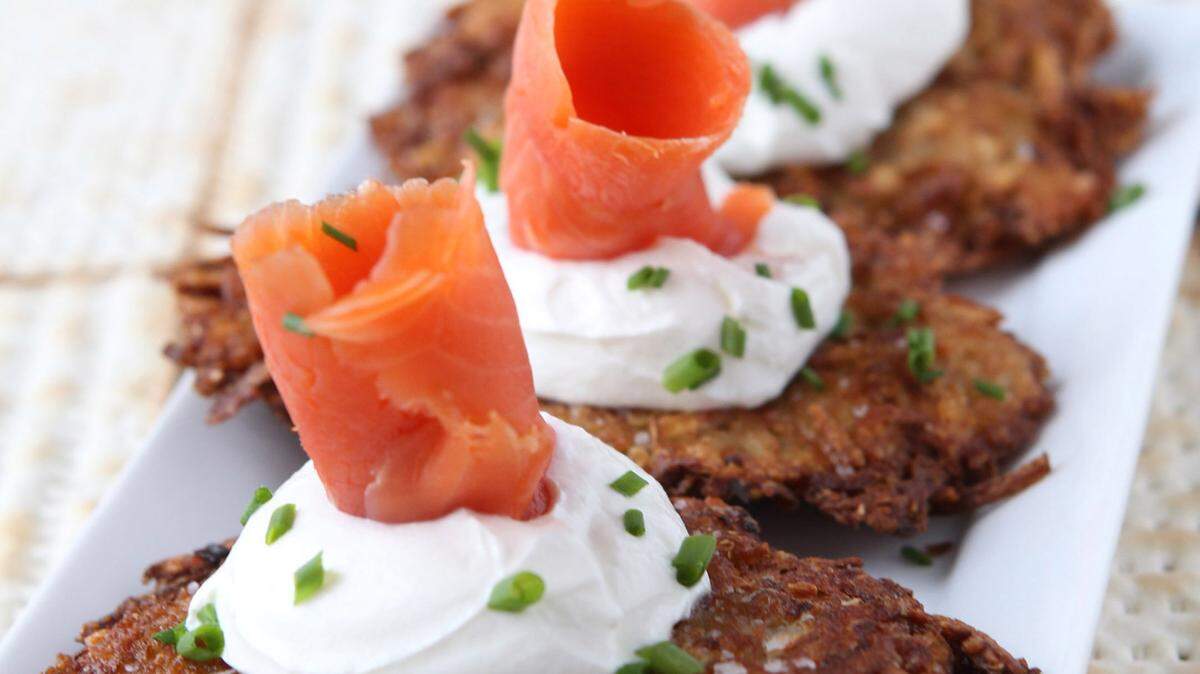 Passover latkes topped with sour cream, lox and chives. (Hillary Levin/St. Louis Post-Dispatch/TNS)