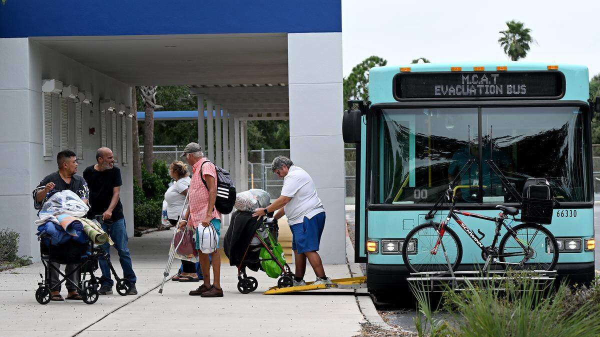 Evacuees arrive at Electa Arcotte Lee Middle School’s evacuation shelter as Hurricane Helene approaches Manatee County on Wednesday, Sept. 25, 2024.