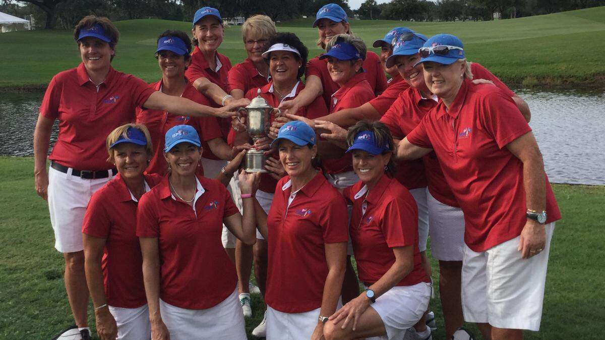 Team USA poses with the ISPS Handa Cup trophy after defeating the World Team on Saturday at Palm Aire Country Club. JASON DILL/jdill@bradenton.com