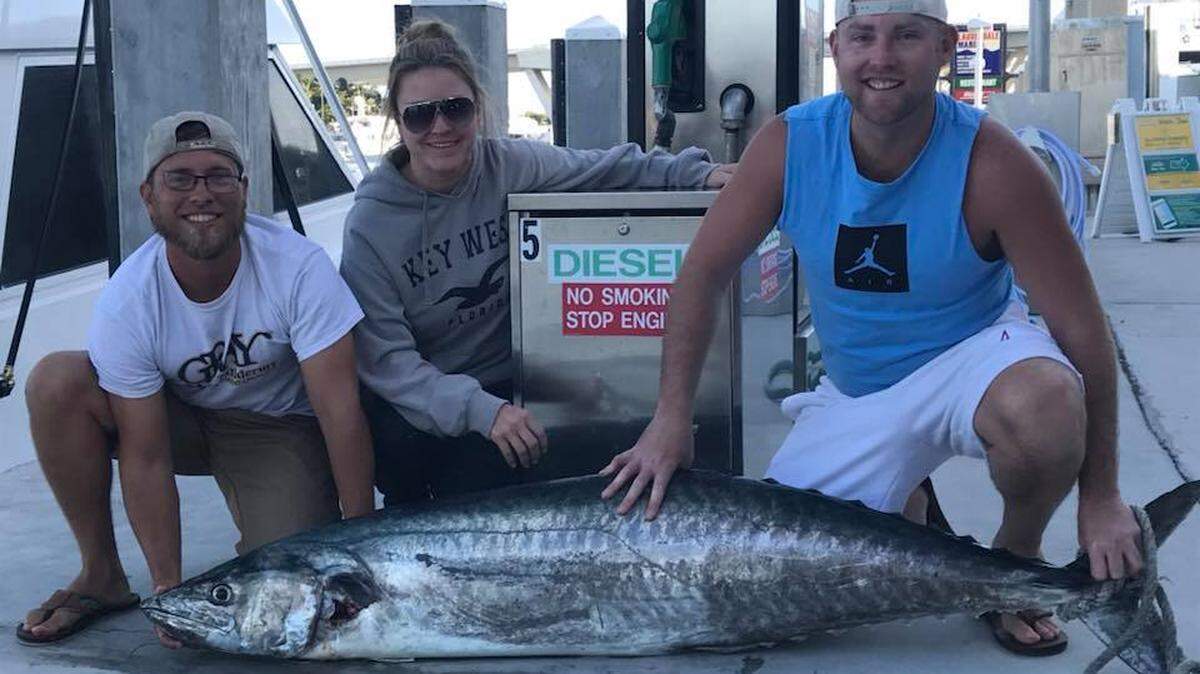 From left: Troy McDonald, Brook Hayes and Michael Hayes with the 97.8-pound kingfish caught off Fort Lauderdale.