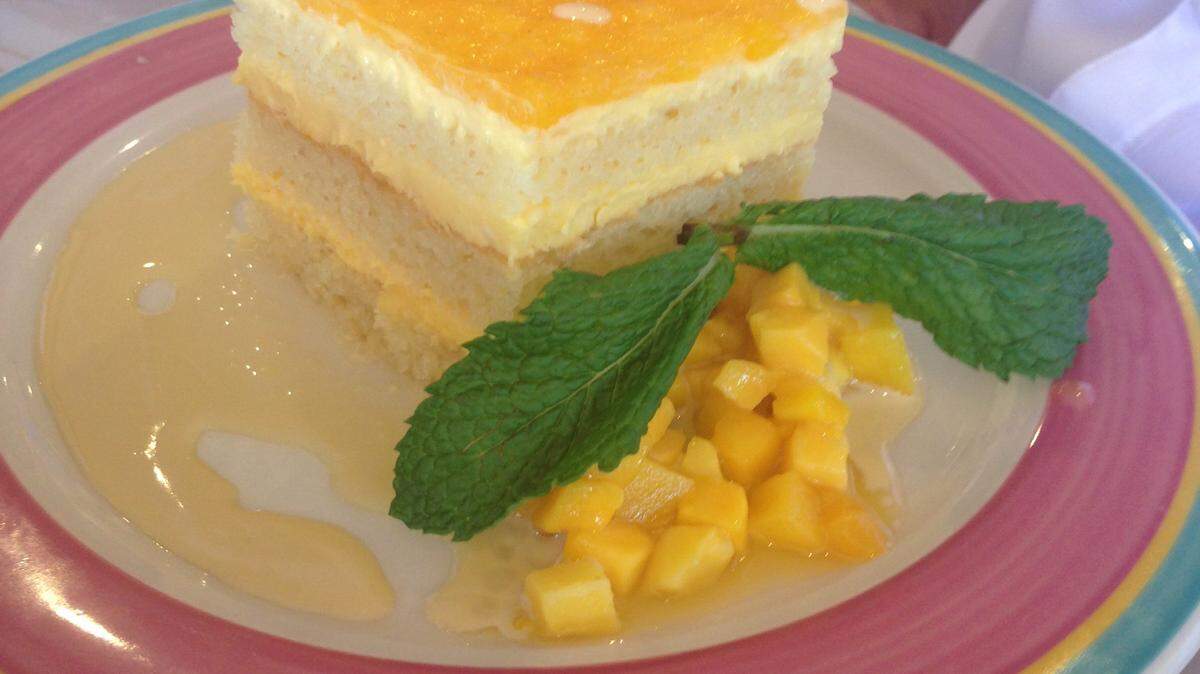 The Mango Mousse Cake at Columbia Restaurant on St. Armands Circle consists of vanilla sponge cake with a hint of coconut layered with a tropical mango mousse infused with passion fruit. 
 JANA MORREALE/Bradenton Herald