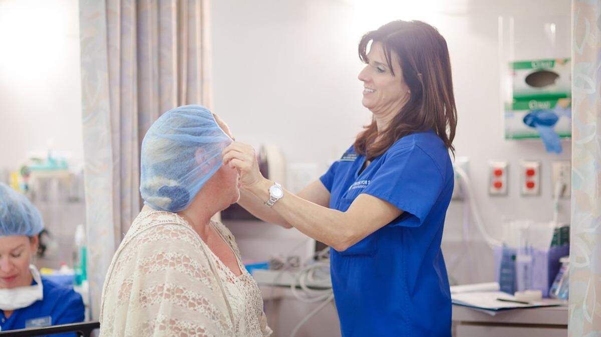 8/2/2010--A nurse helps a cataract surgery patient during a Mission Cataract event at Center For Sight in Sarasota.