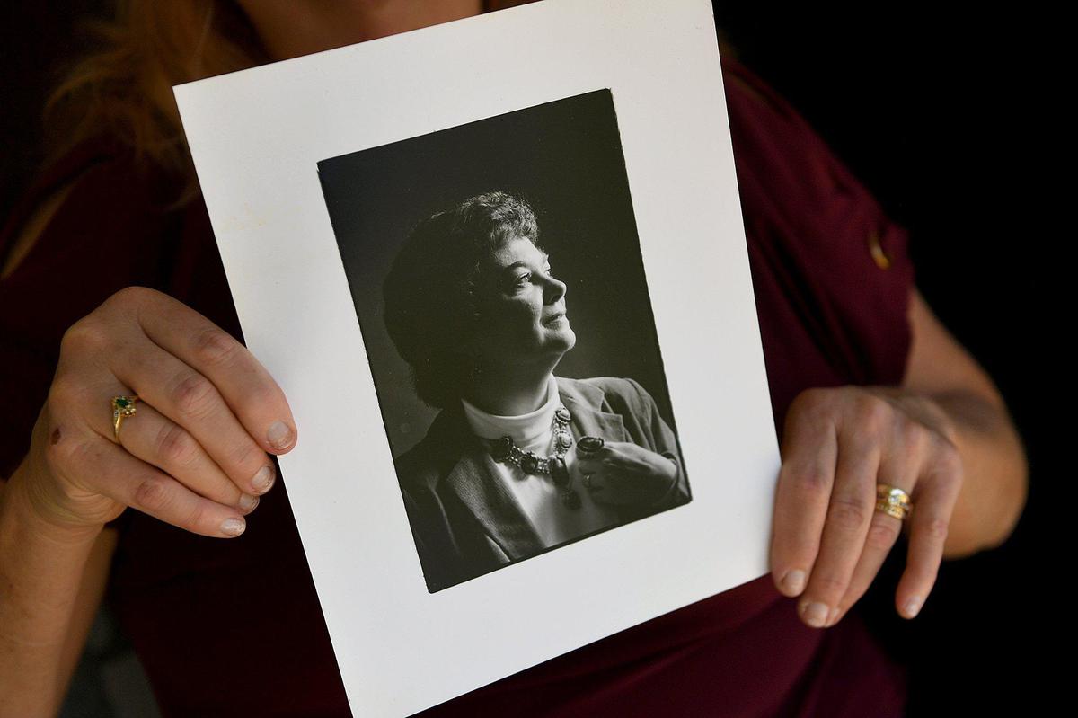 Patti Varrato, daughter of Patricia Schafer, who died of COVID-19 in the Braden River Rehabilitation Center, holds a photo of her mother.
