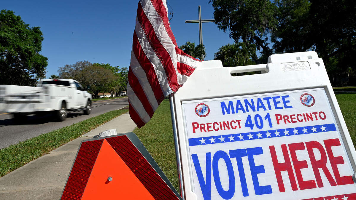 A sign for precinct 401 sits along 26th Street West outside Bayside Church on election day, March 19, 2024.