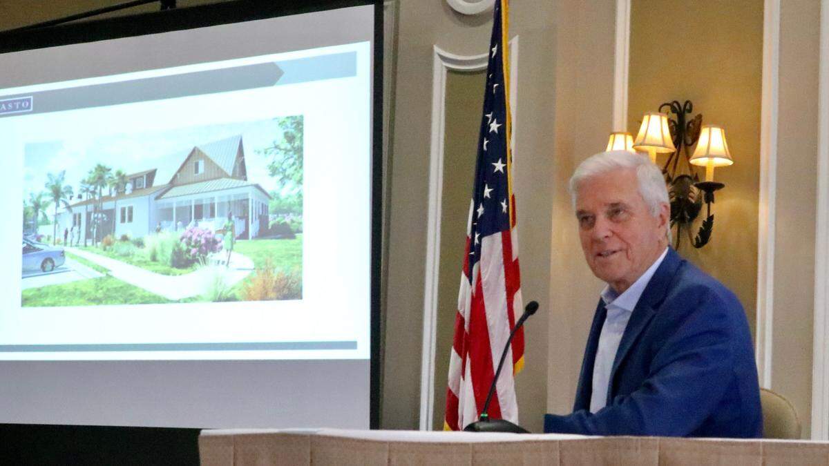 With an artist’s conception of Owens Fish Camp restaurant projected to his right, Brett Hutchens briefed a Lakewood Ranch Business Alliance Audience on the progress of Center Point at Waterside on 2/23/2022.