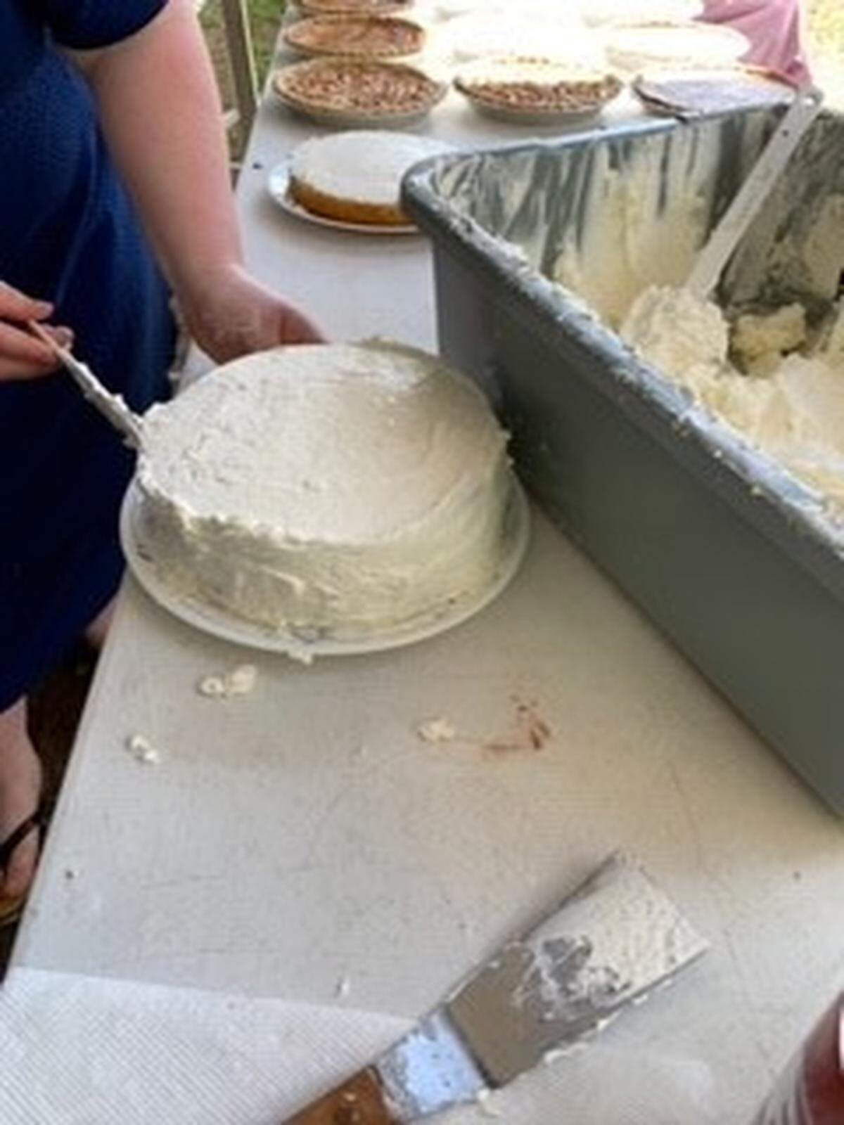 Many chocolate and vanilla cakes were baked and iced.