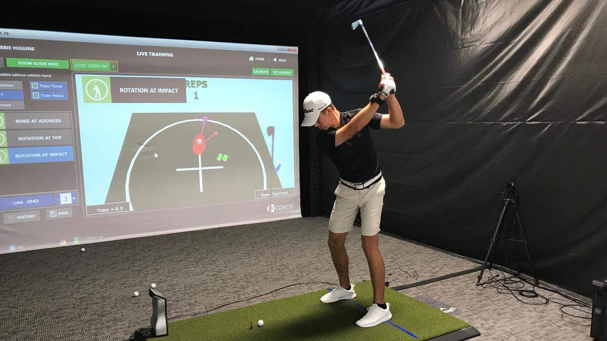 Robbie Higgins works on his swing at the PGA Tour Superstore, which opens its doors Saturday in The Shoppes at University Town Center, 8237 Cooper Creek Blvd., University Park.