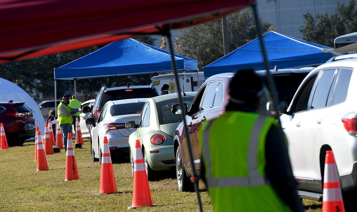 12/30/20--Residents 65 and over lined up to receive the Moderna vaccine at the Manatee County Public Safety complex.