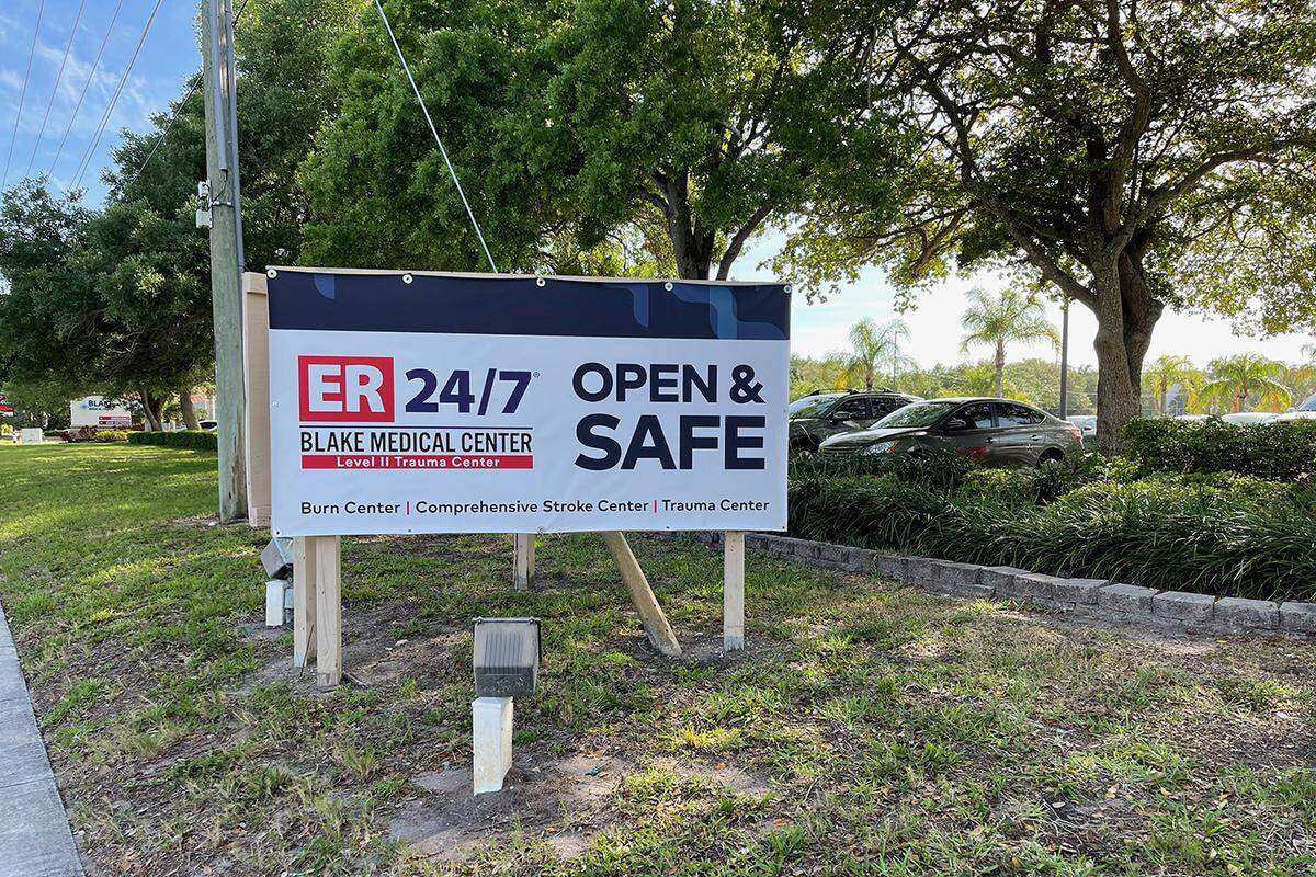 Cindy Johnson believes her husband, Steven, caught covid-19 from staff at Blake Medical Center in Bradenton, Florida, in November 2020. After his death, she asked a doctor who sees patients at the hospital to take down the big “OPEN & SAFE” sign outside.