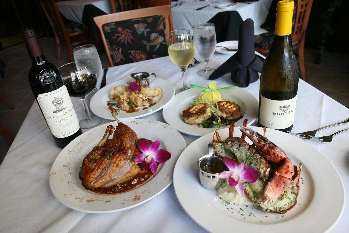 Cinnamon-dusted crispy half duck and broiled Maine lobster at Michael John’s Restaurant in Bradenton.
