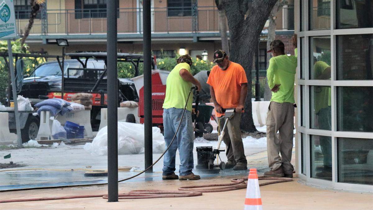 Work was underway Wednesday on the sidewalks around Bradenton’s City Centre Parking Garage, and city officials are hopeful the public can begin parking there by month’s end.