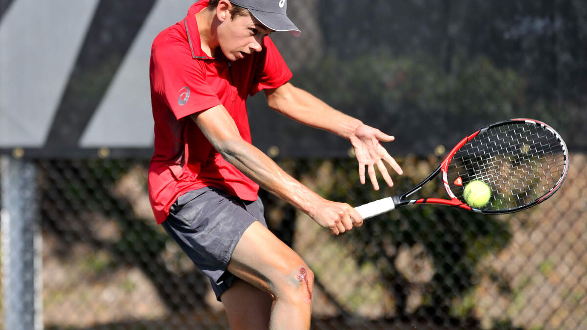 alex DeMinaur makes a backhand return in Eddie Herr Junior Championship Saturday Dec 5th.