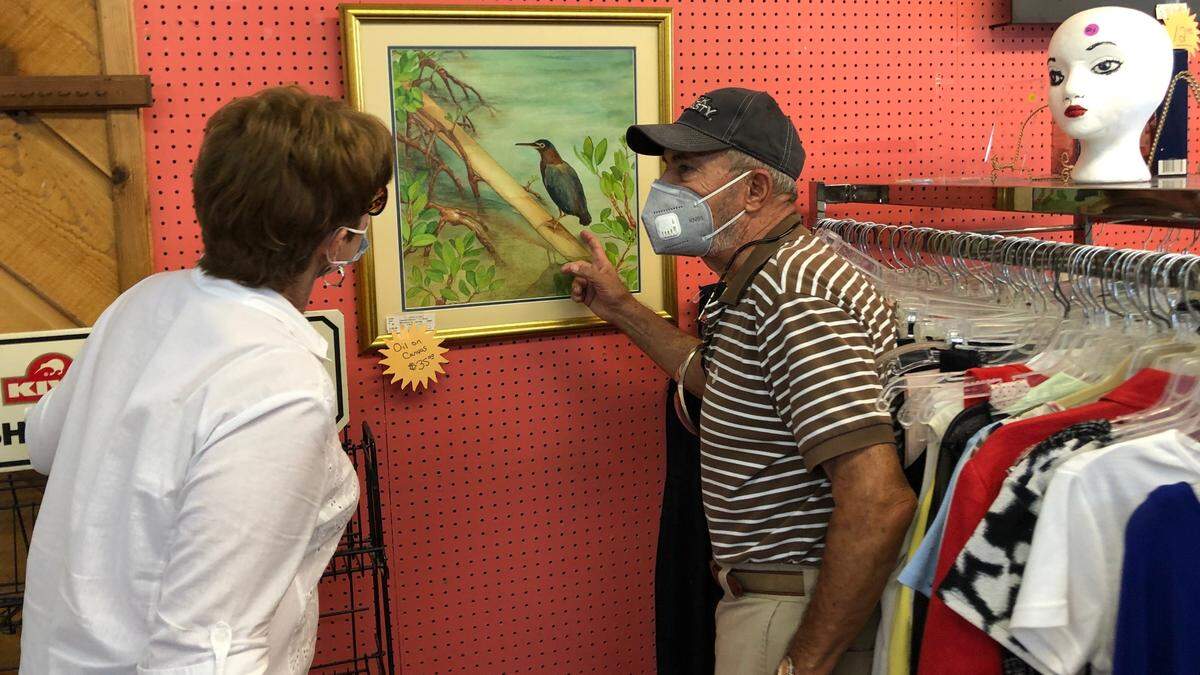 Theo and Sheryl Cajoleas, owners of What A Find! Consignment and Thrift, 5231 Manatee Ave. W., require customers to wear a mask in their store.