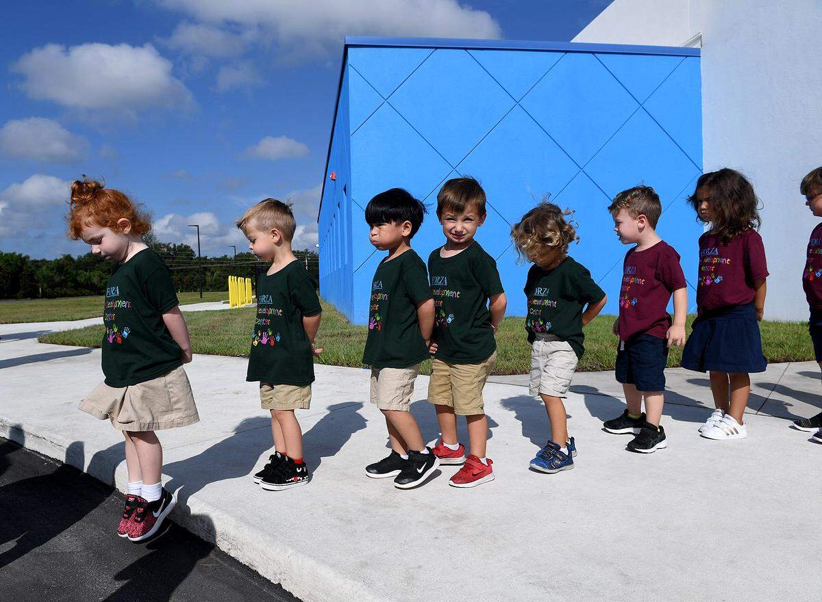 Little students make their way outside at the ribbon cutting ceremony for the Parrish Charter Academy in 2019.