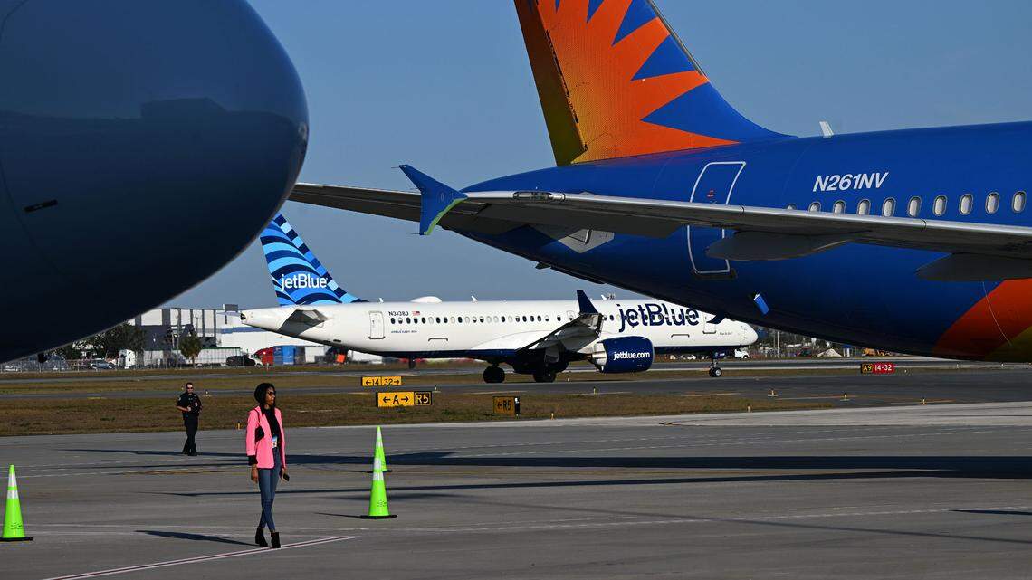 A reporter wanders among the aircraft parked at SRQ’s newest concourse. Guests had an opportunity to see Sarasota-Bradenton International Airport’s new concourse during a VIP event Wednesday. Concourse A has it’s own TSA checkpoint and gates for Allegiant Air.