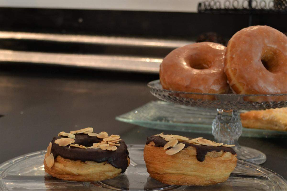Sugar Cubed Pastry Lab's "cronut of the month" sits in the foreground. A cronut is a pastry mash-up of a croissant and a donut.