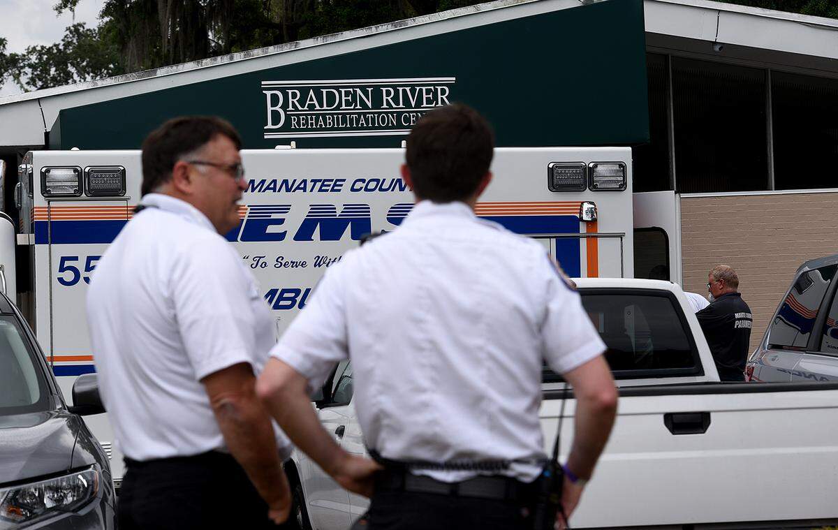 Paramedics respond to the Braden River Rehabilitation Center which is one of the long-term care facilities where residents or staff have tested positive for the coronavirus.