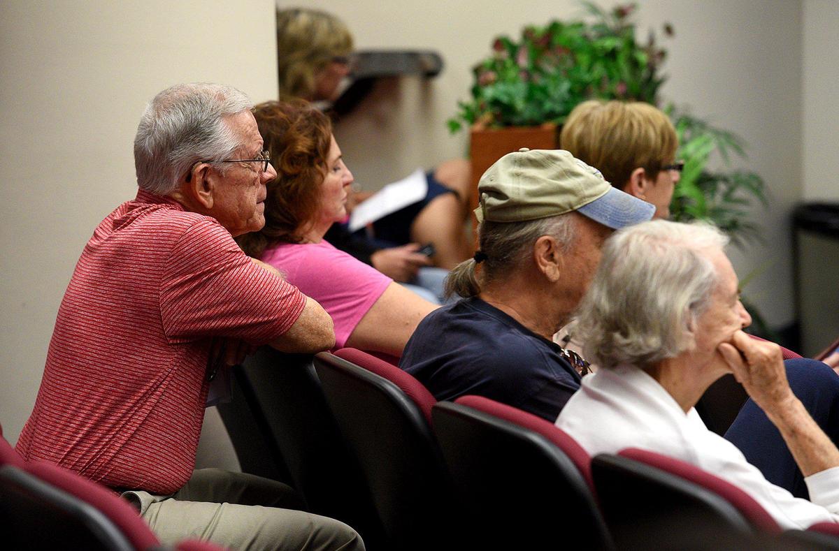 Manatee Board of County Commissioners follow Sarasota officials by indicating their support for a ban on the sale of retail pets during Thursday’s meeting. Animal lovers filled the room wearing red shirts.
