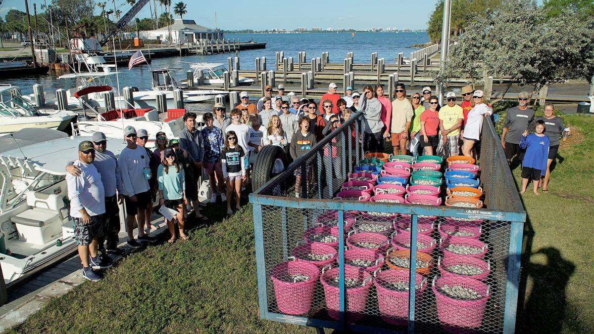 Sarasota Bay Watch volunteers took part in a clam release in March. To date, the nonprofit has released more than 1.5 million clams into Sarasota Bay to aid in restoration efforts.