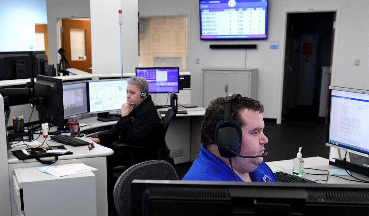 911 operators Adam Bruner and Lisa Kalmbach take calls in the Public Safety complex in Bradenton. For the first time, Florida is activating protocols for enhanced screening of 911 calls in order to determine if first responders could be walking into situation with a potential case of the novel coronavirus, known as COVID-19.