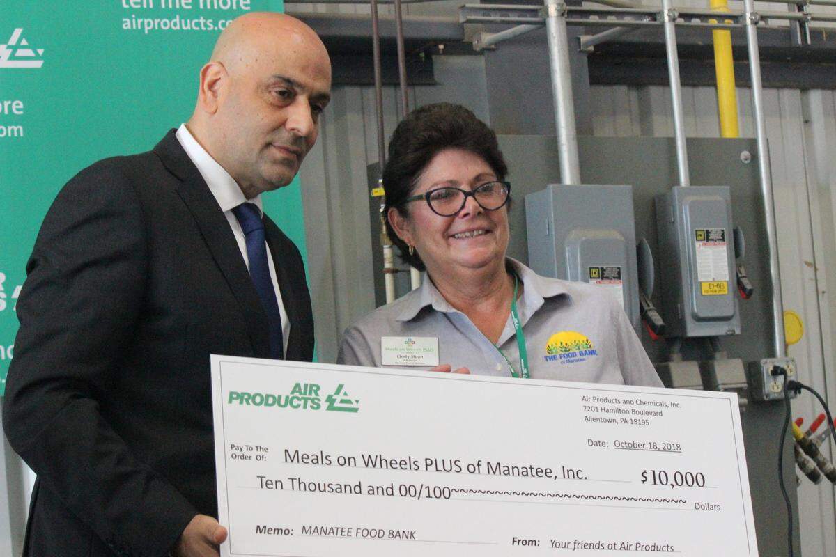 On the occasion of the expansion of facilities at Air Products, Samir Serhan Thursday presented a check for $10,000 to Manatee Food Bank. Accepting was Cindy Sloan.