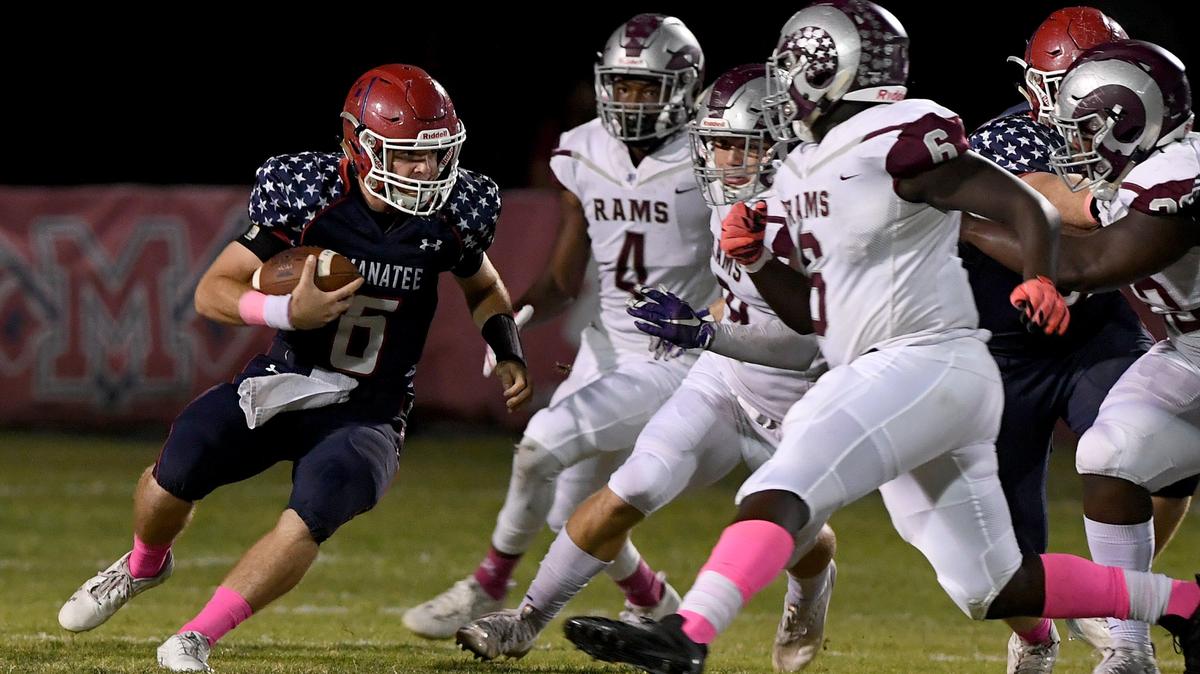 Manatee’s Anthony Squitieri runs the ball against Riverview’s defense at Manatee High Friday night.
