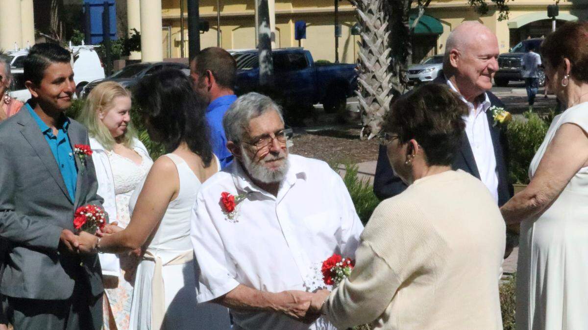 Eleven couples exchange d wedding vows in front of the Historic Manatee County Courthouse on Valentine’s Day, Feb. 14.