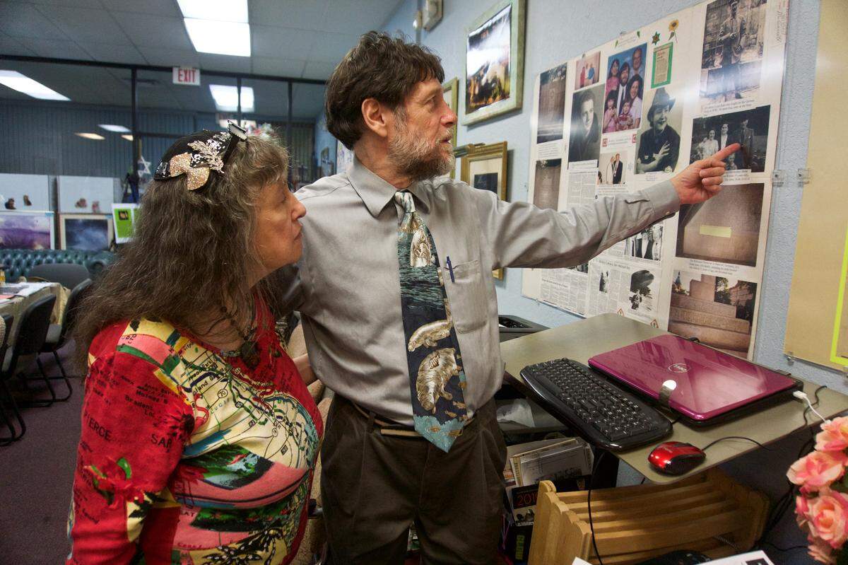 Beverly and Lawrence Newman share one of many stories preserved at the Al Katz Center for Holocaust Survivors and Jewish Learning, in the Cortez Commons Shopping Center.