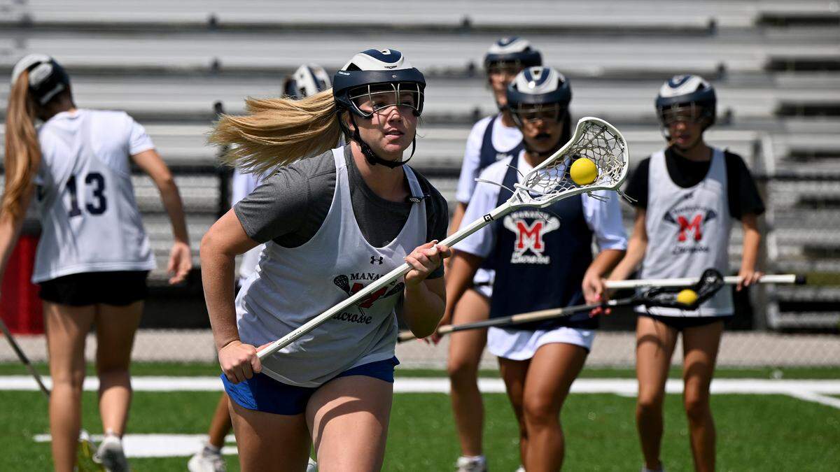 Mallory Adams works on her skills during girls lacrosse practice at Manatee High’s football stadium on Thursday, April 4, 2024.