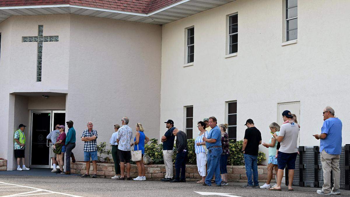 A line of voters waits outside the Church of Hope in Palmetto on Nov. 5, 2024.