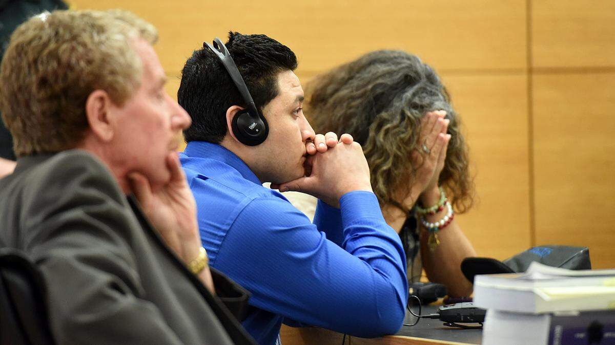 Melvin Quevedo sits between his attorney, Peter Coen, and his praying translator as a guilty verdict is read by the clerk in court Thursday. Quevedo was found guilty of manslaughter with a weapon in the death of Herman Tabora-Discua after Quevedo, Tabora-Discua and another man got into a fight at Mami Carmen's Restaurant. 
 TIFFANY TOMPKINS/Bradenton Herald