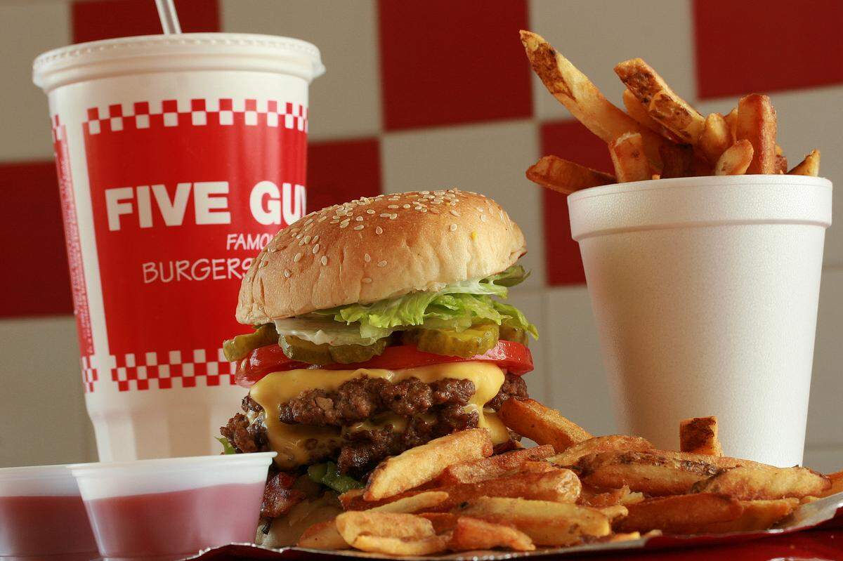A bacon cheeseburger, made with love and attention to detail by burger artisans at Five Guys in Bradenton, is stuffed to the gills with ample toppings and served with fresh-cut French fries.
