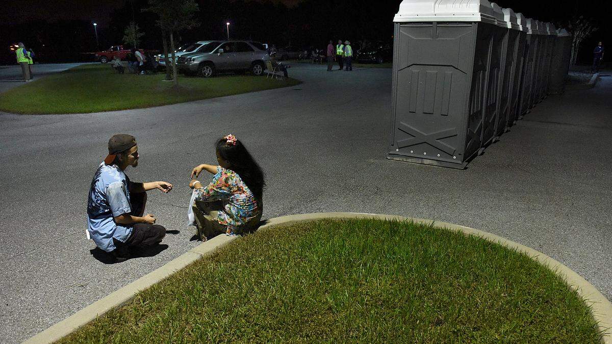 Buddy Bigham and Ivan W. sit in the parking lot of Manatee Technical College of the eve of the weekend's huge medical event, Remote Area Medical, which is expected provide free care for thousands. 
 TIFFANY TOMPKINS-CONDIE/Bradenton Herald