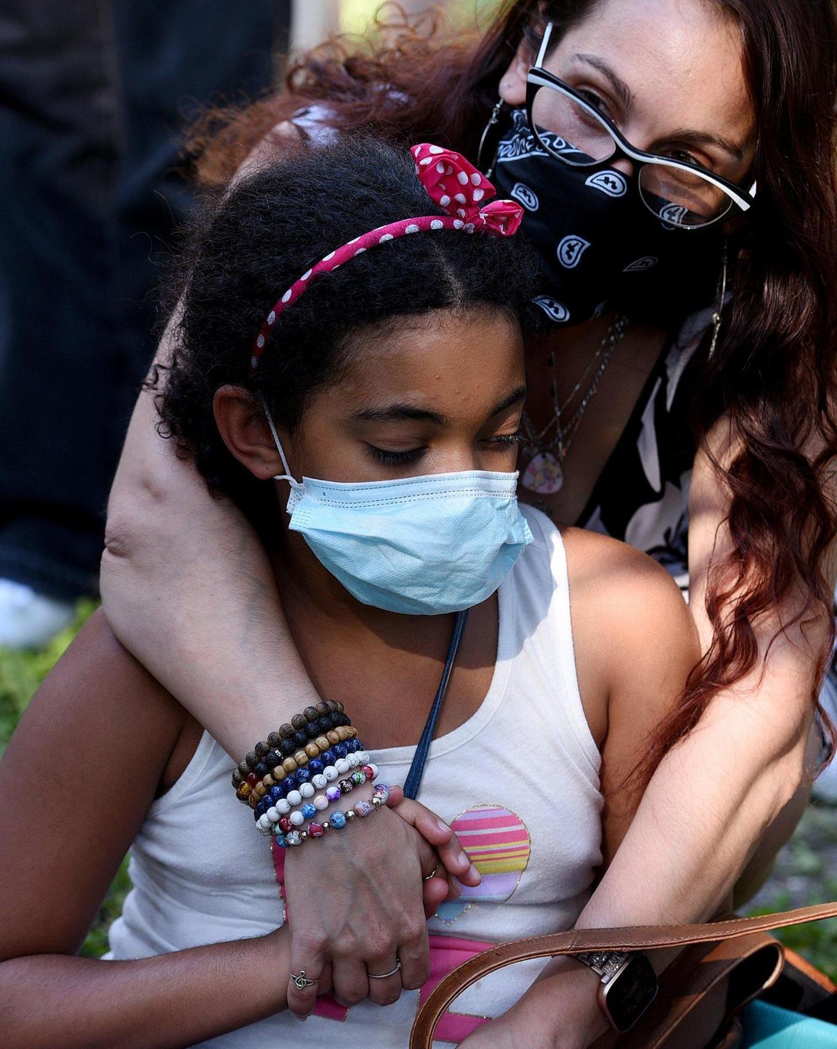 Karissa Forlenza, 10, and her mother, Kiera, attend a Black Lives Matter protest in Sarasota to highlight case of Ronald Davenport, who was charged with resisting without violence during a traffic stop on May 12, 2020.