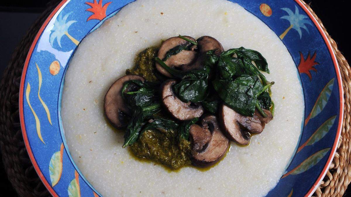 Grits with pesto, baby bella mushrooms and spinach. Recipes on Page 3D. Photos by Nate Guidry/Pittsburgh Post-Gazette/TNS