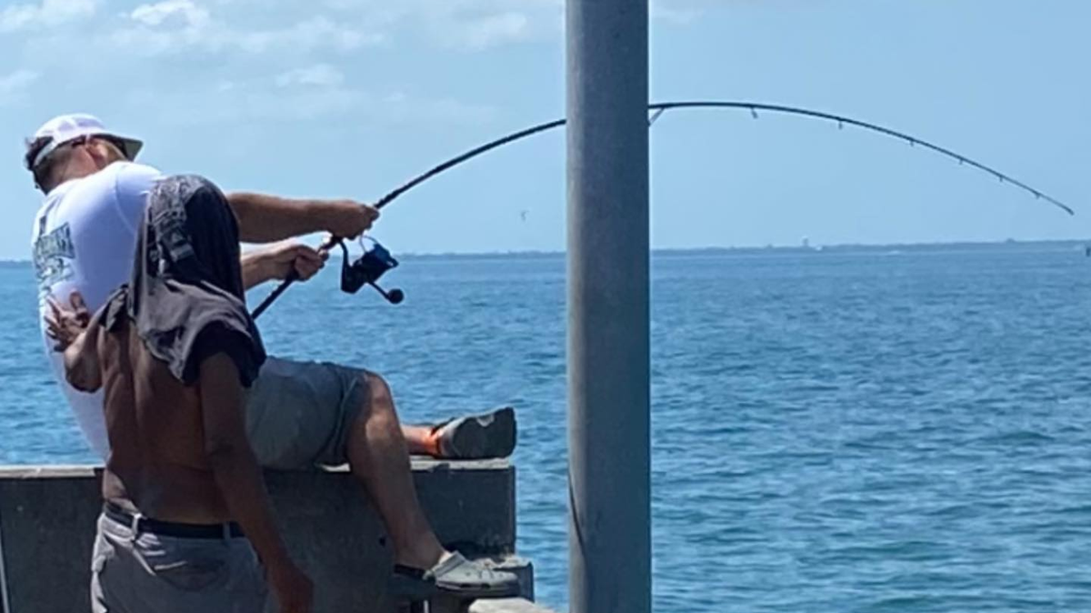 Kaleb Guillotte fights for a goliath grouper on the Sunshine Skyway Bridge on May 13, 2023.