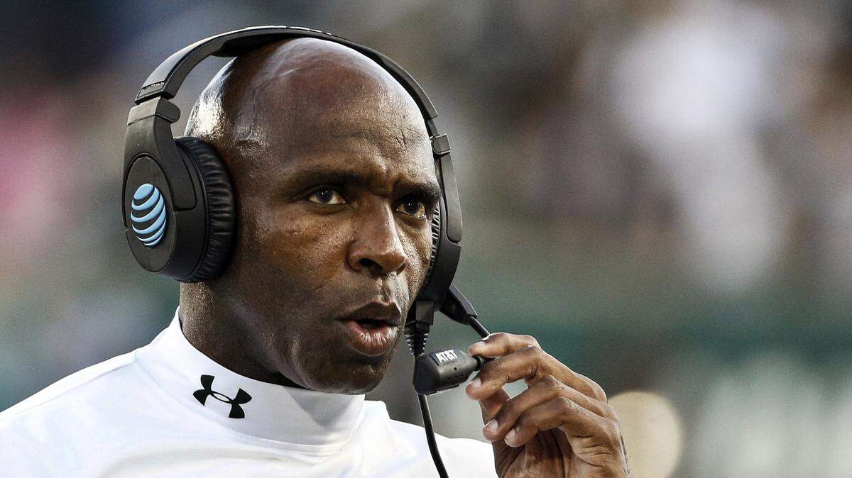 In this Oct. 21, 2017, file photo, South Florida head coach Charlie Strong looks on during the first half of an NCAA college football game against Tulane in New Orleans, La.